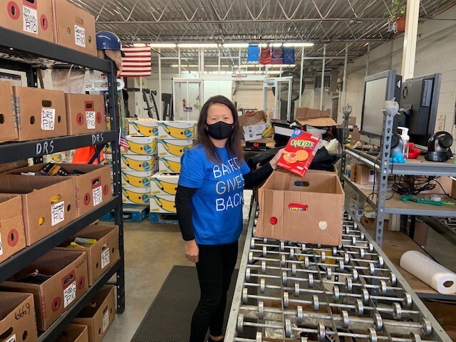 Kim at Gleaners 2020-holding crackers.jpg